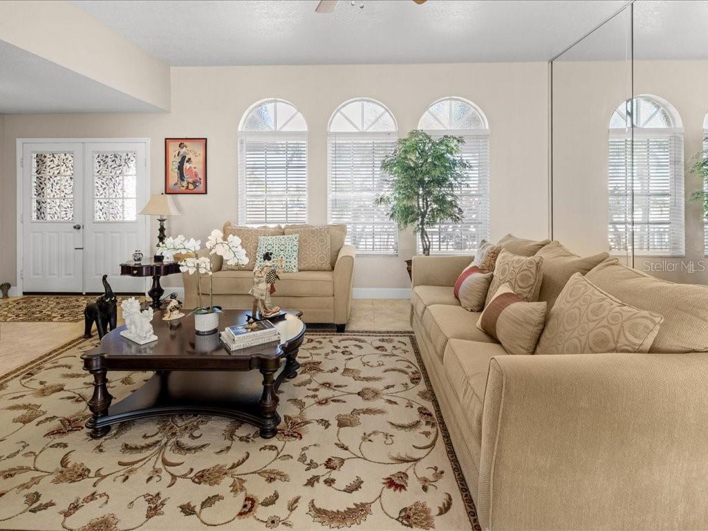 25263 Padre Lane Punta Gorda, FL 33983 - Photo 11 of 60 a living room with furniture and a large window