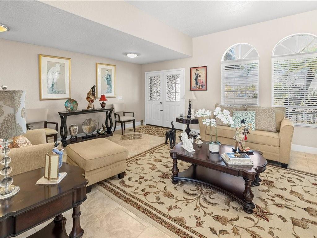 25263 Padre Lane Punta Gorda, FL 33983 - Photo 12 of 60 a living room with furniture and a large window