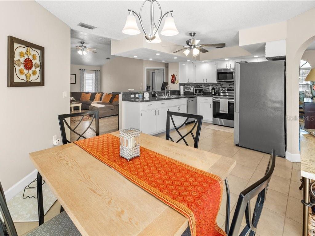 25263 Padre Lane Punta Gorda, FL 33983 - Photo 20 of 60 a dining table & chairs in a kitchen