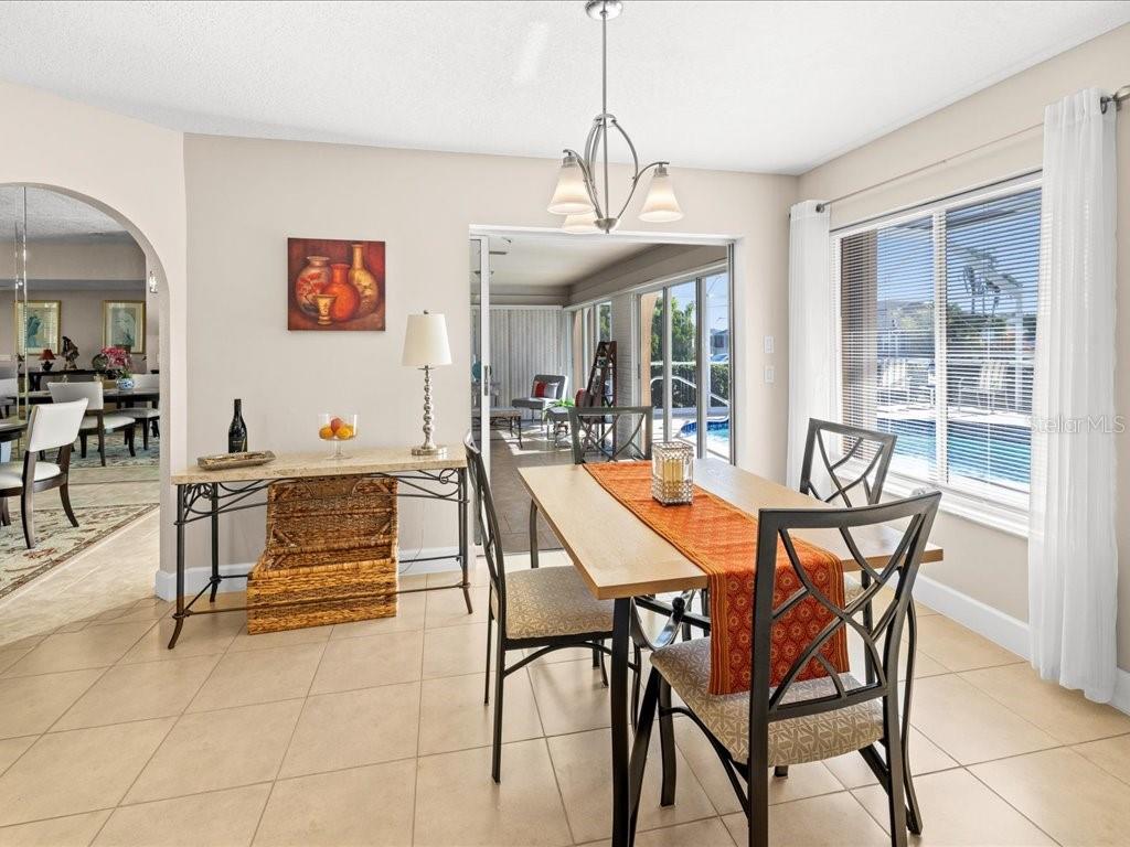 25263 Padre Lane Punta Gorda, FL 33983 - Photo 21 of 60 a view of a dining room with furniture window and outside view