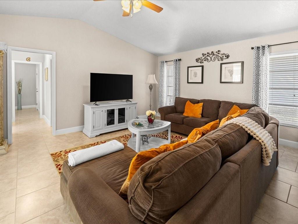 25263 Padre Lane Punta Gorda, FL 33983 - Photo 22 of 60 a living room with furniture and a flat screen tv