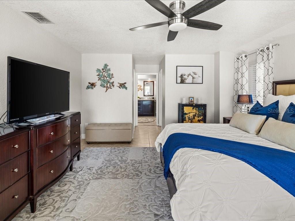 25263 Padre Lane Punta Gorda, FL 33983 - Photo 26 of 60 a living room with furniture and a flat screen tv