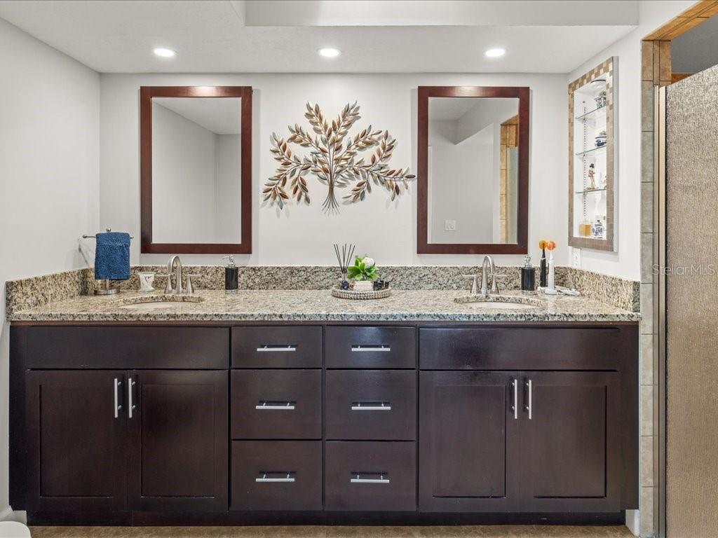 25263 Padre Lane Punta Gorda, FL 33983 - Photo 27 of 60 a bathroom with a granite countertop sink and a mirror