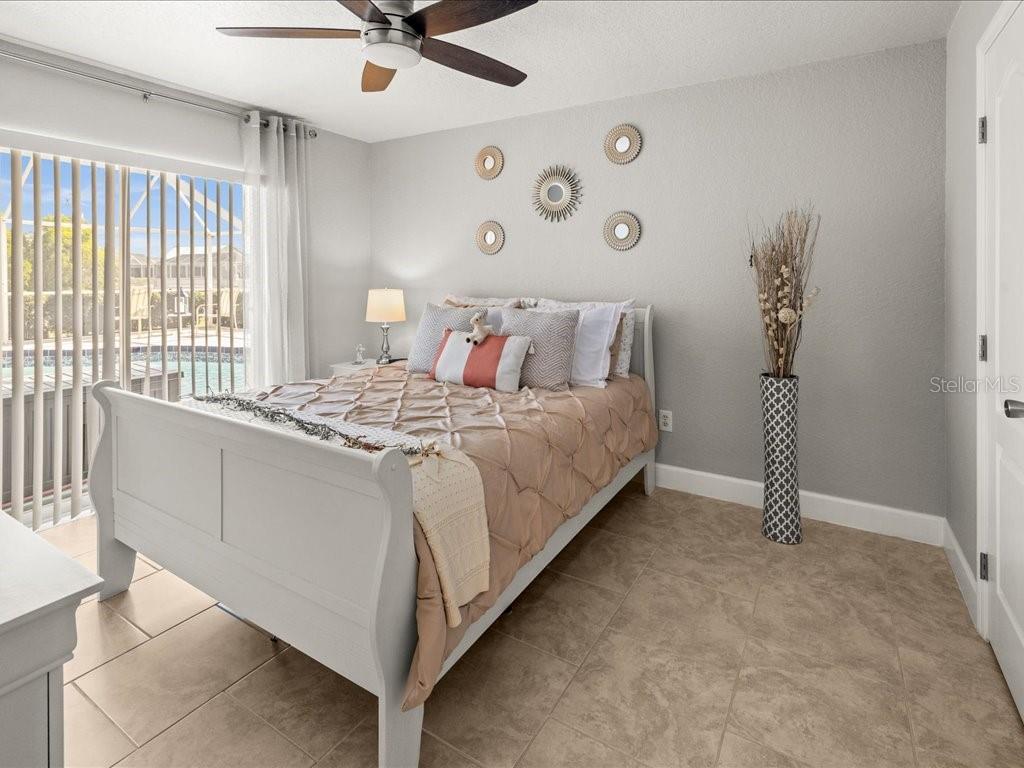 25263 Padre Lane Punta Gorda, FL 33983 - Photo 33 of 60 a bedroom with a bed and a table in it