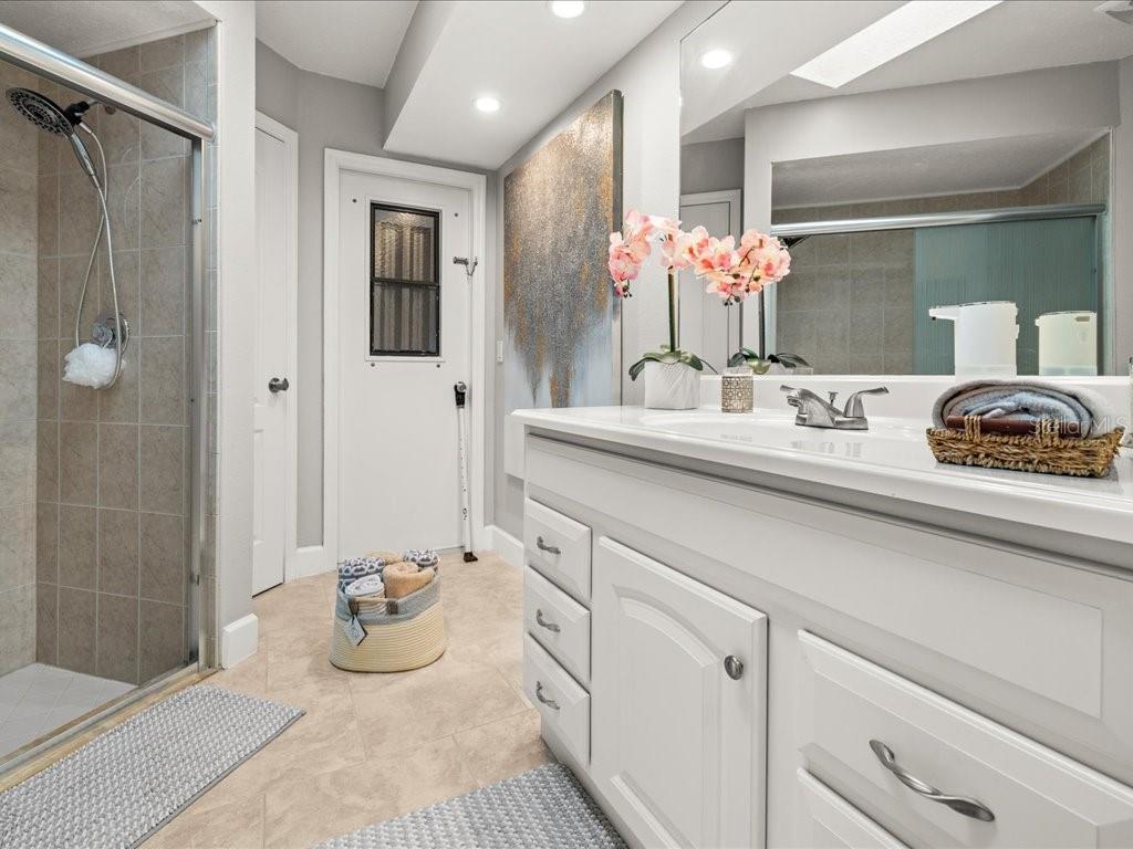 25263 Padre Lane Punta Gorda, FL 33983 - Photo 34 of 60 a bathroom with a sink a vanity and a mirror