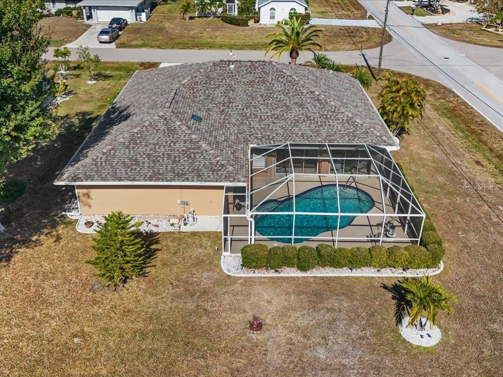 25263 Padre Lane Punta Gorda, FL 33983 - Photo 46 of 60 an aerial view of a house with a garden and lake view