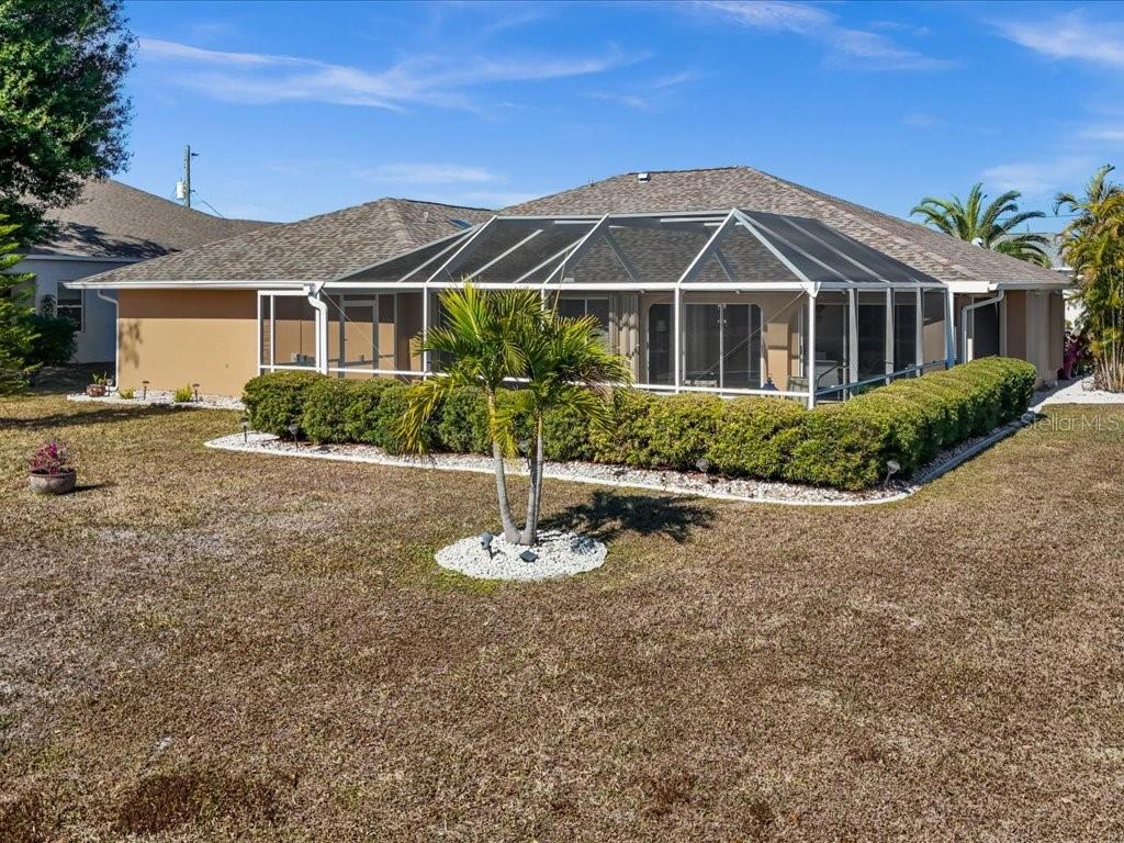 25263 Padre Lane Punta Gorda, FL 33983 - Photo 47 of 60 a front view of a house with a yard