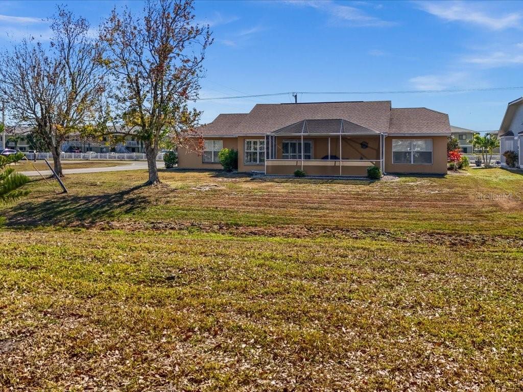 25263 Padre Lane Punta Gorda, FL 33983 - Photo 51 of 60 a front view of a house with a yard