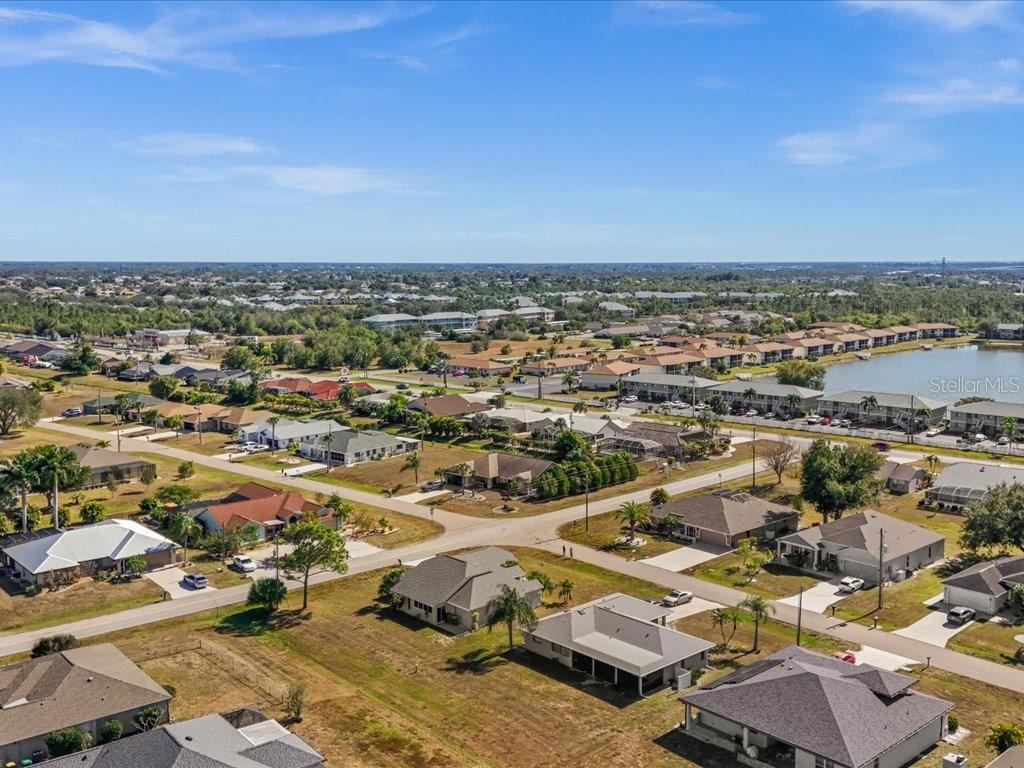 25263 Padre Lane Punta Gorda, FL 33983 - Photo 55 of 60 an aerial view of residential houses with outdoor space