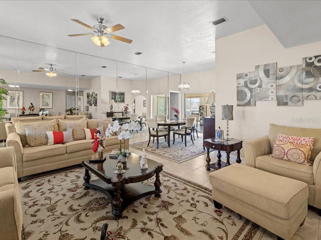 25263 Padre Lane Punta Gorda, FL 33983 - Photo 8 of 60 a living room with furniture and kitchen view