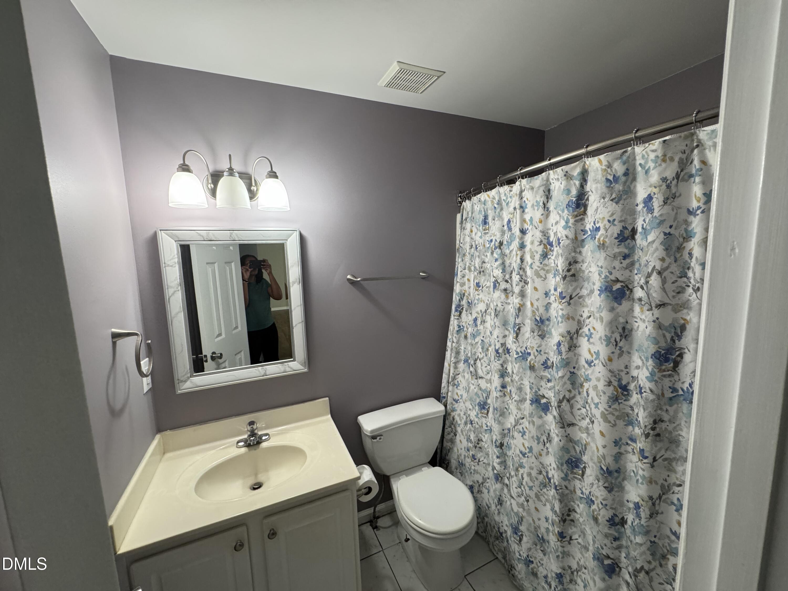 1318 Bobbitt Road Kittrell, NC 27544 - Photo 12 of 15 a bathroom with a toilet sink and mirror
