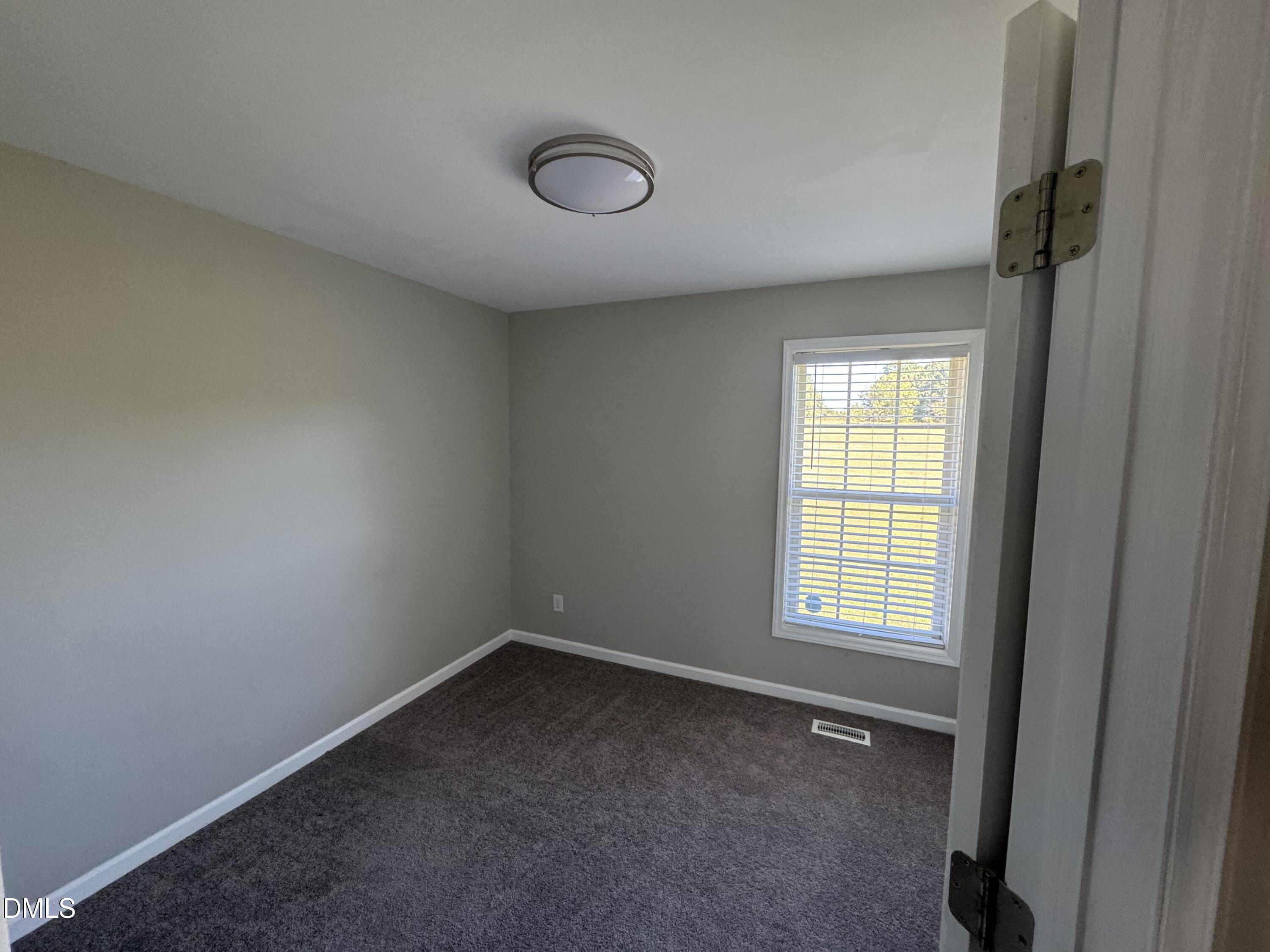 1318 Bobbitt Road Kittrell, NC 27544 - Photo 13 of 15 an empty room with a window