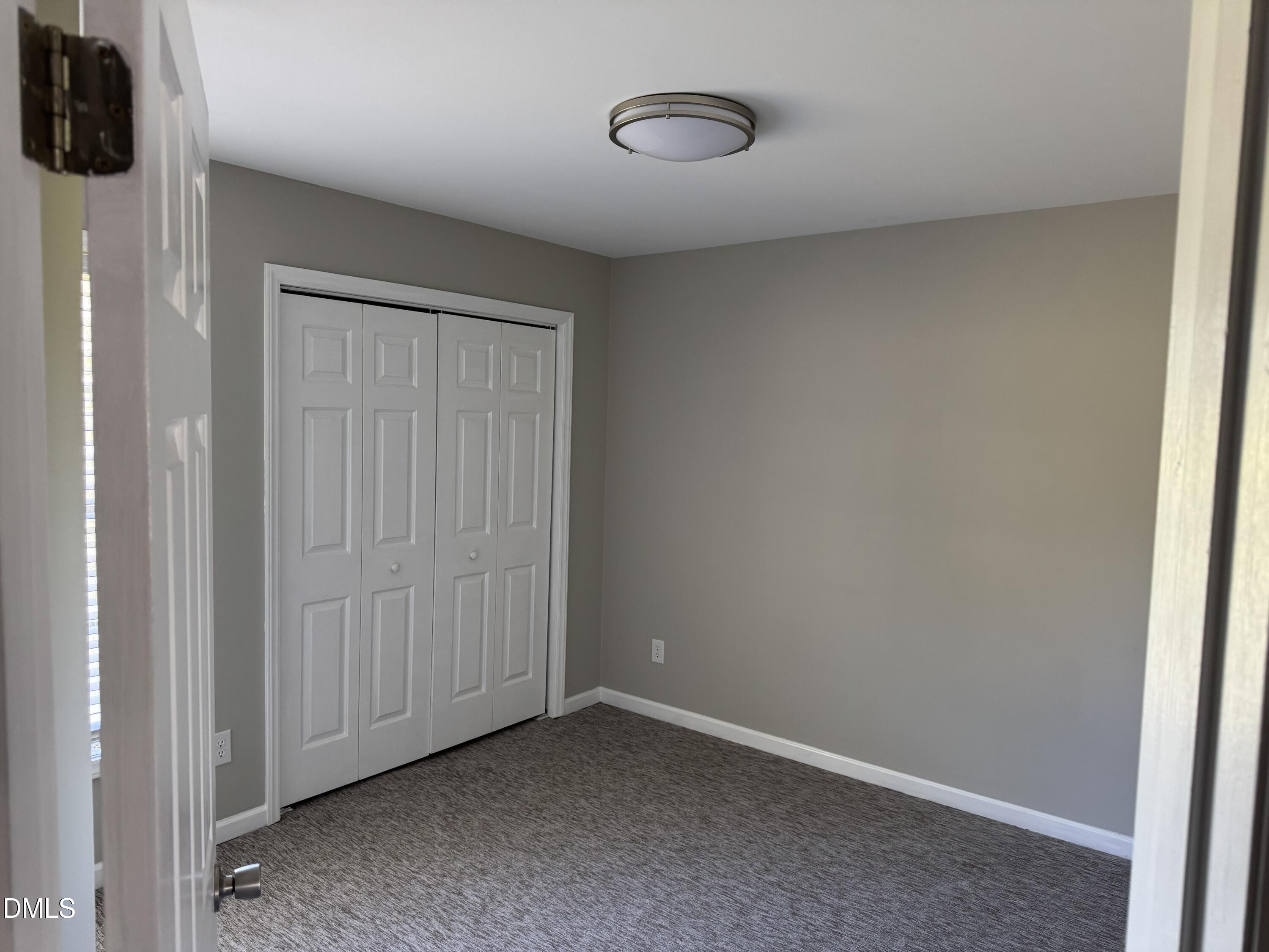 1318 Bobbitt Road Kittrell, NC 27544 - Photo 14 of 15 an empty room with a wooden door
