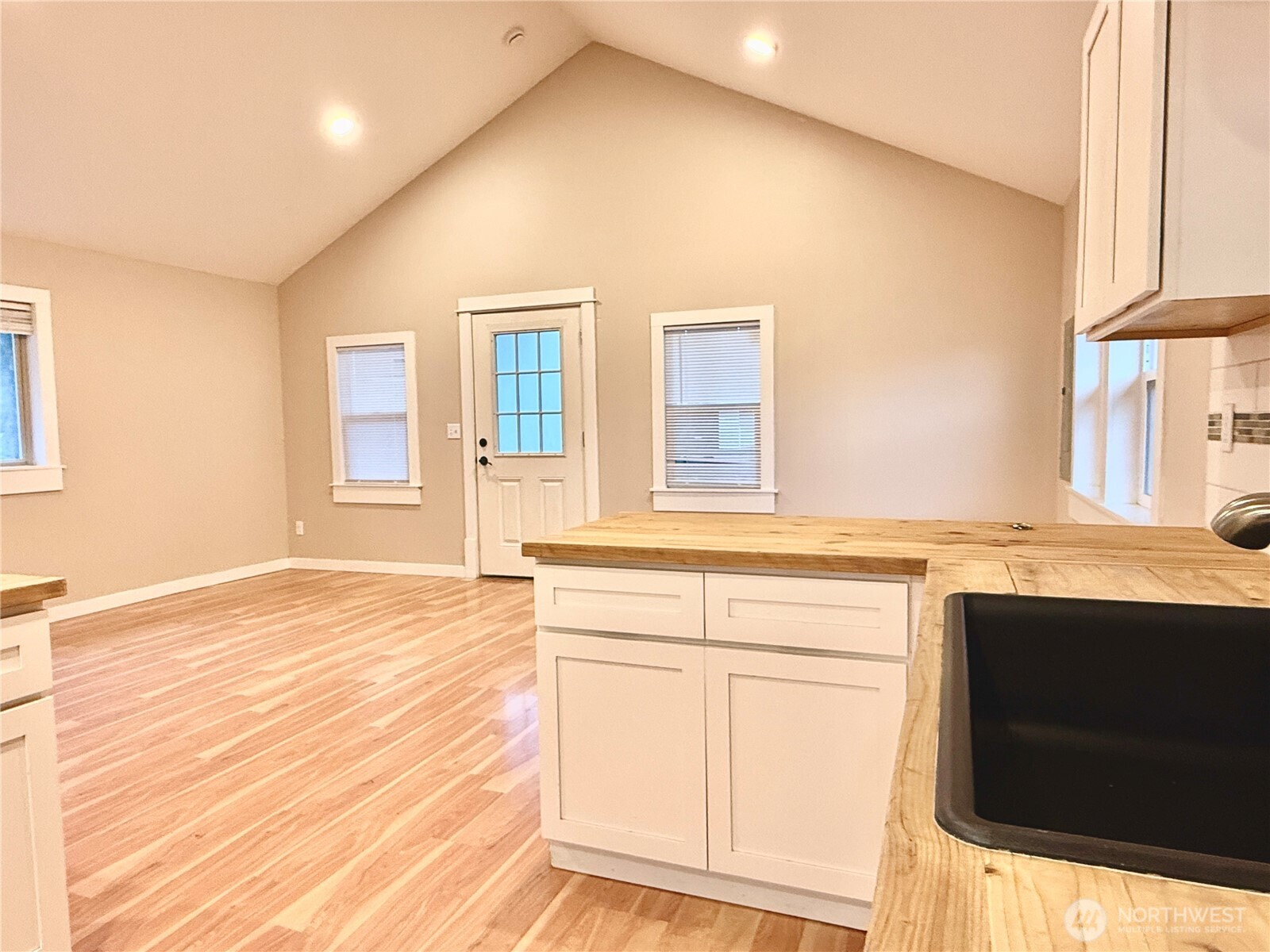1010 Talcott Street Sedro-Woolley, WA 98284 - Photo 14 of 27 a bathroom with a sink and a washing machine with wooden floor