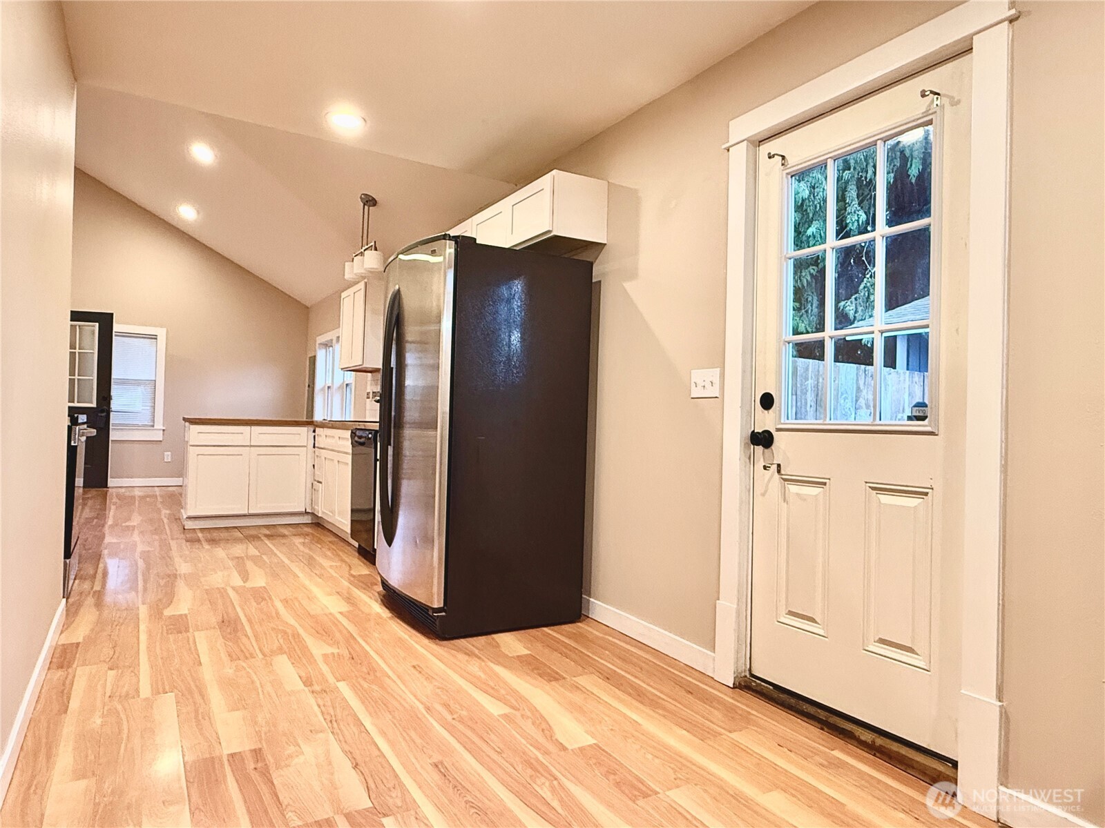 1010 Talcott Street Sedro-Woolley, WA 98284 - Photo 15 of 27 a view of a refrigerator in kitchen and wooden floor