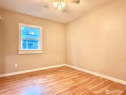 a view of a room with a wooden floor