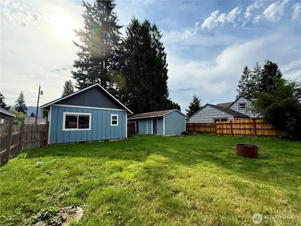 a front view of a house with yard