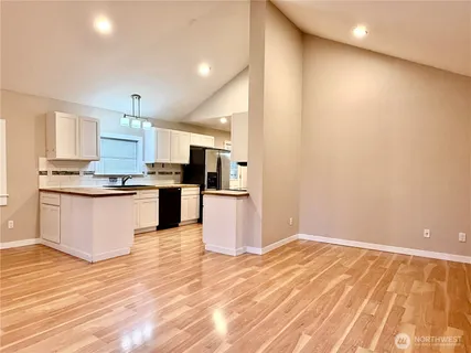 a view of kitchen with wooden floor