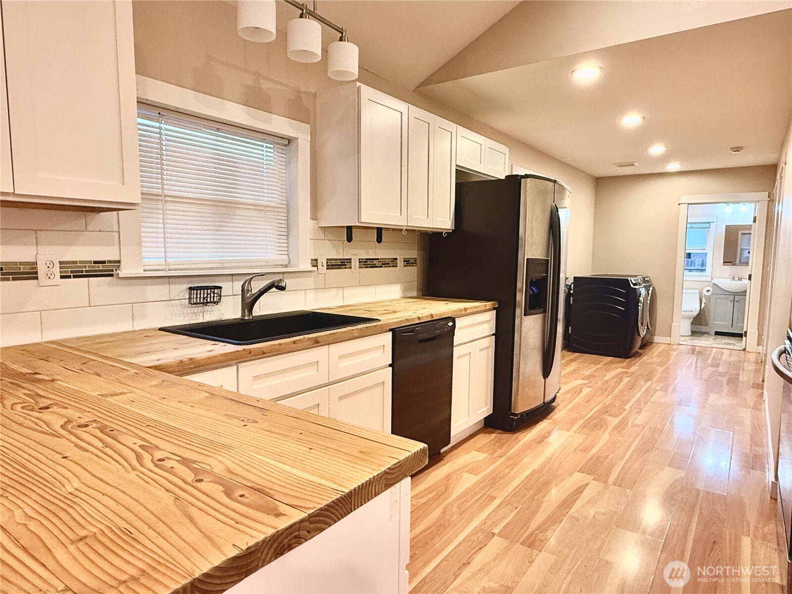 1010 Talcott Street Sedro-Woolley, WA 98284 - Photo 7 of 27 a kitchen with a sink stove and refrigerator