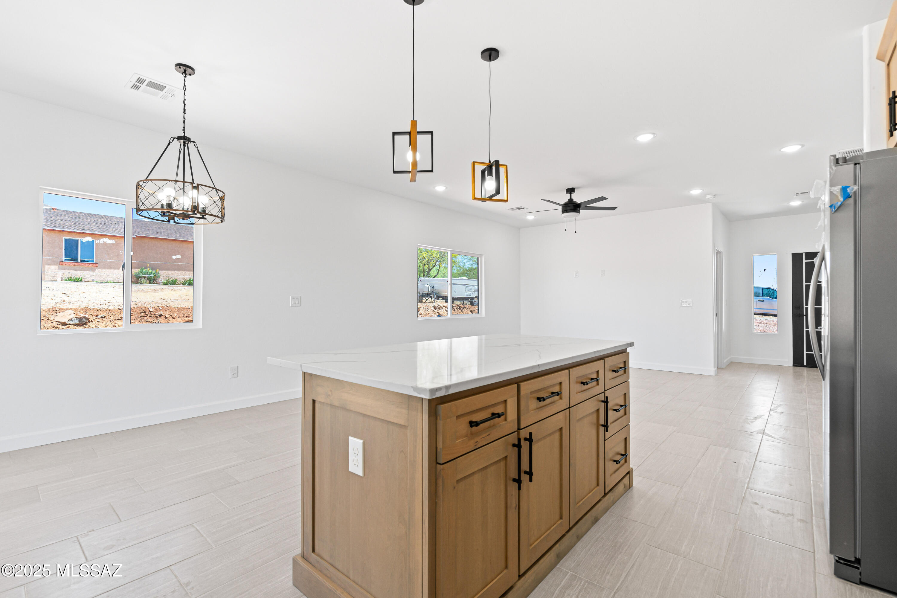 1560 Pinguinos Court Rio Rico, AZ 85648 - Photo 8 of 33 a kitchen with stainless steel appliances granite countertop a sink a stove and a wooden floors