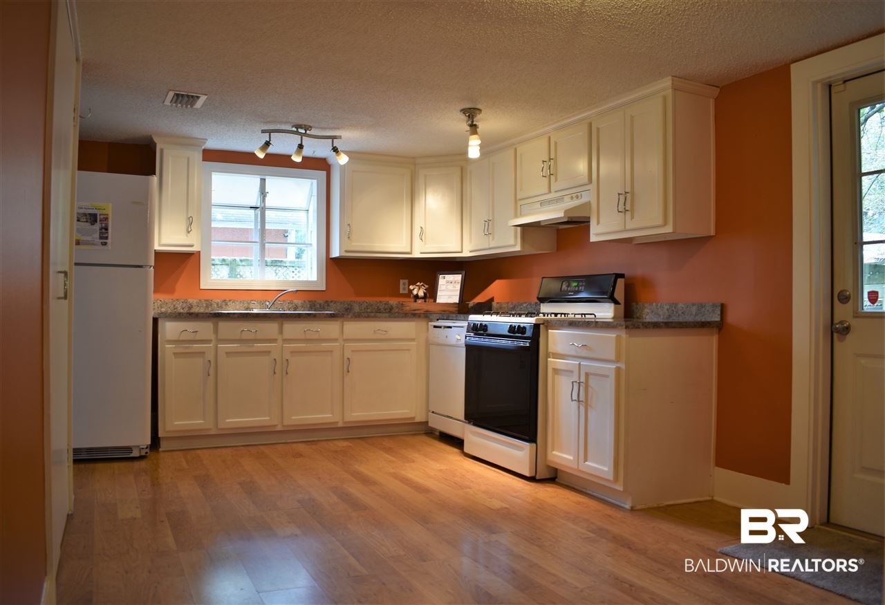 134 Hyland Avenue Mobile, AL 36607 - Photo 5 of 16 Room for dining table & backyard grilling access