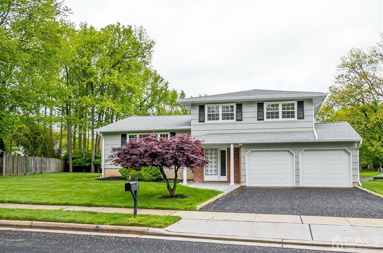 8 Eagle Road Edison, NJ 08820 - Photo 1 of 28 a front view of a house with a garden and plants