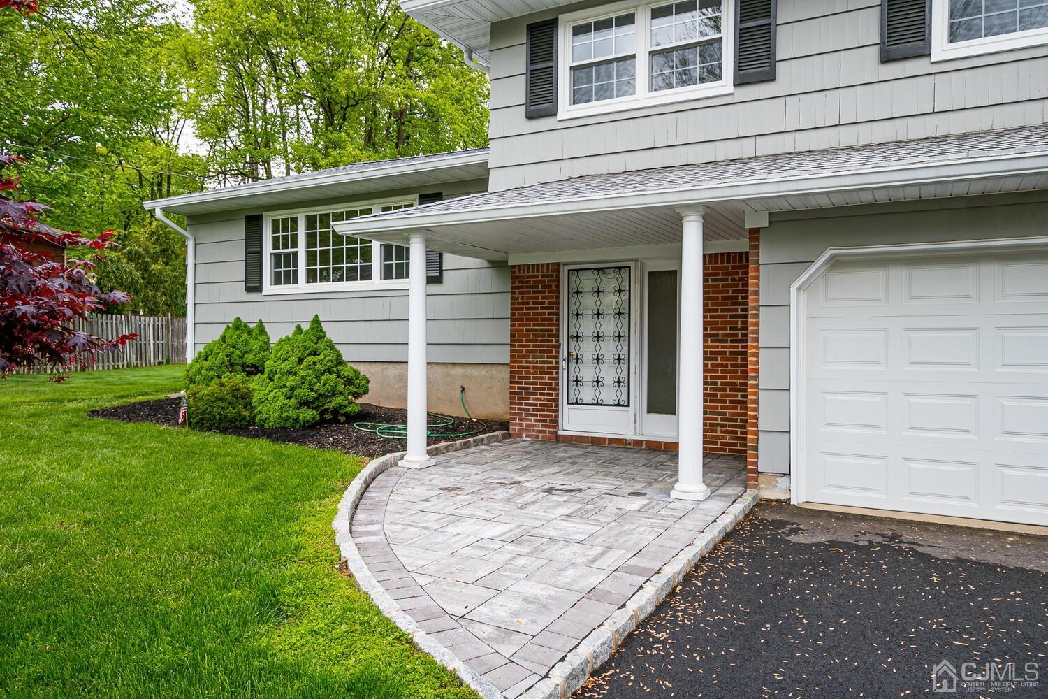 8 Eagle Road Edison, NJ 08820 - Photo 2 of 28 front view of a house with a yard