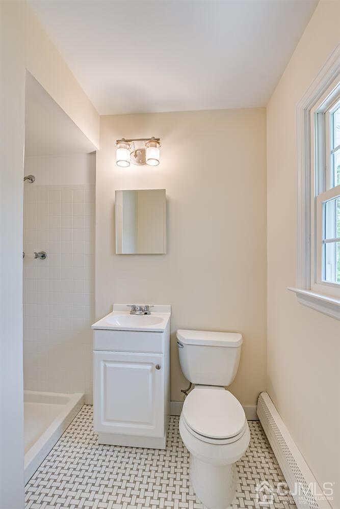 8 Eagle Road Edison, NJ 08820 - Photo 12 of 28 a bathroom with a sink toilet and a mirror