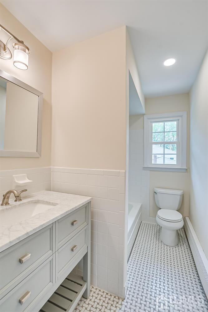 8 Eagle Road Edison, NJ 08820 - Photo 16 of 28 a bathroom with a sink a toilet and a mirror