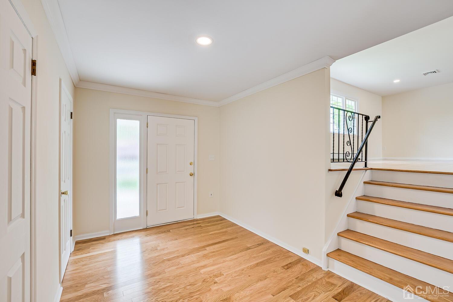 8 Eagle Road Edison, NJ 08820 - Photo 3 of 28 a view of a room with wooden floor and stairs