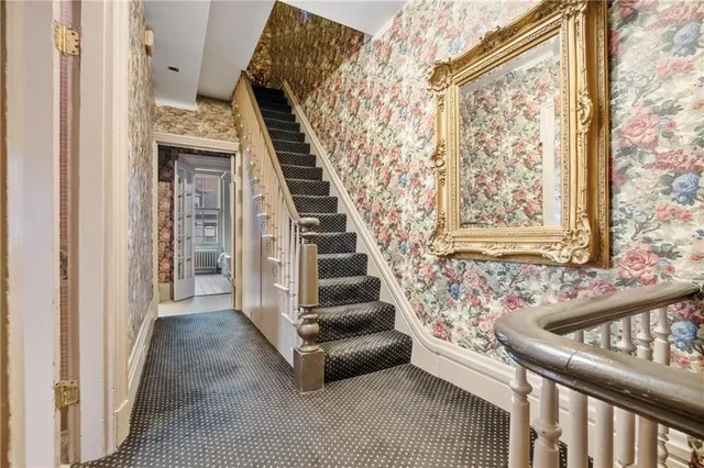 a bedroom with a bed and a fireplace