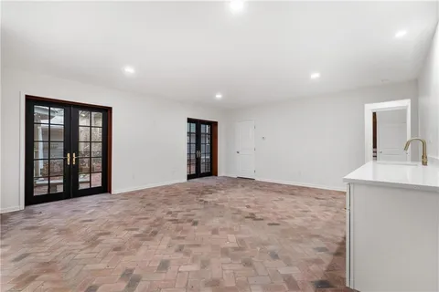 a kitchen with a stove oven and sink