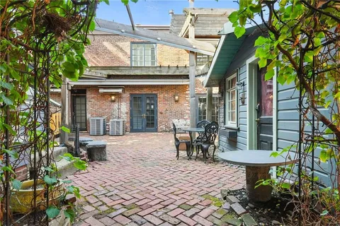 a view of a chairs and table in a patio