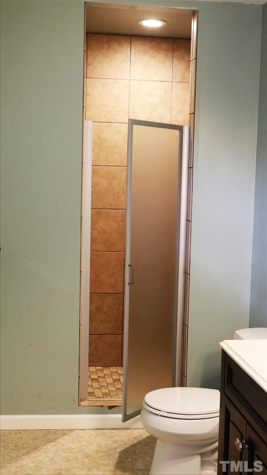 4609 Radcliff Road Raleigh, NC 27609 - Photo 15 of 15 a bathroom with a toilet and a shower