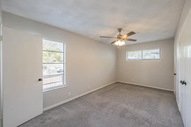 a bathroom with a toilet a sink a vanity and mirror
