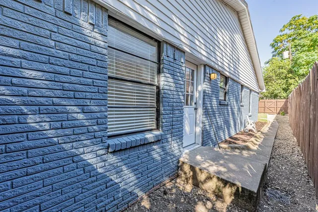 a backyard of a house with seating space