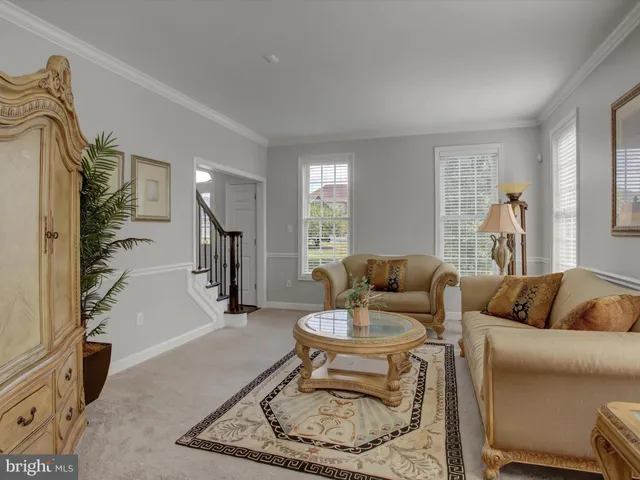 a kitchen with granite countertop white cabinets and a sink