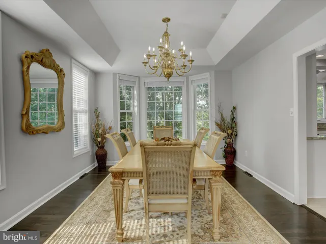 a large kitchen with kitchen island a sink stainless steel appliances and cabinets