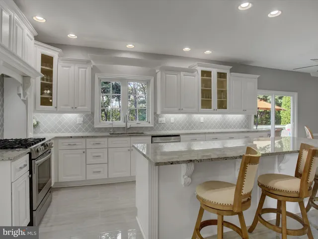 a living room with a fireplace and lots of clutter