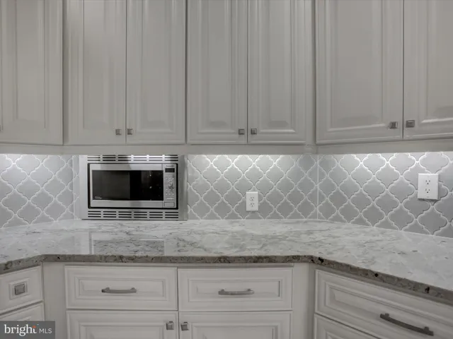 a view of a sink and cabinets