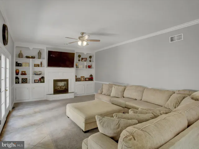 a bedroom with a bed and a flat screen tv in it
