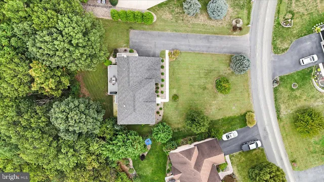 a view of an entryway with wooden floor and a chandelier