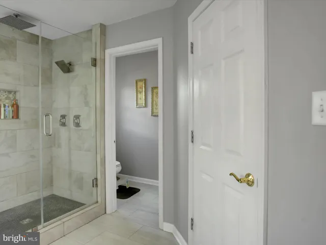 a view of deck with table and chairs under an umbrella with wooden floor