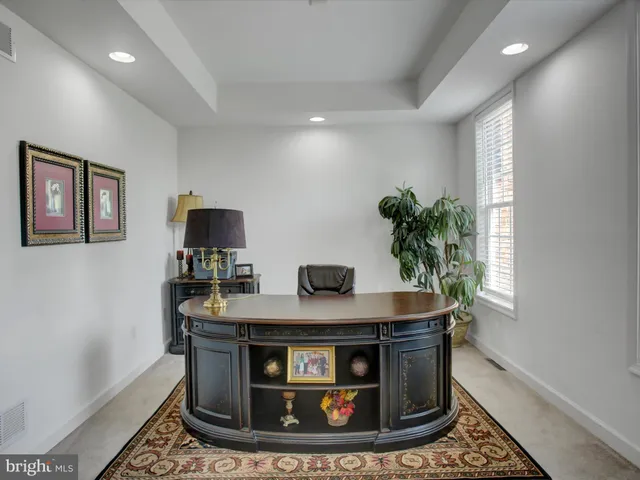 a living room with furniture and a rug