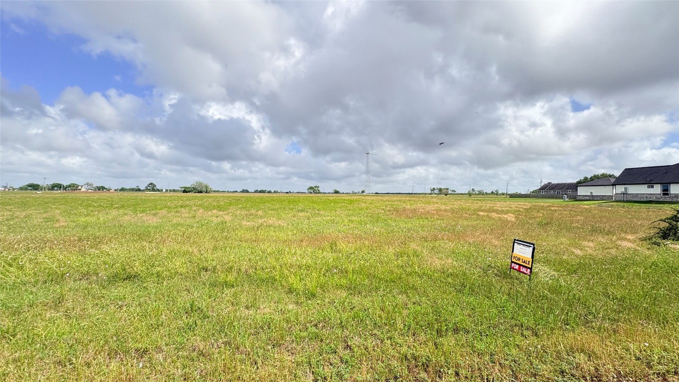 383 Brahman Trail Angleton, TX 77515 - Photo 1 of 7 a view of a large body of water and an outdoor space