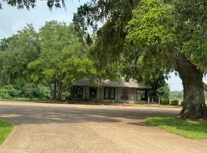 383 Brahman Trail Angleton, TX 77515 - Photo 6 of 7 a front view of a house with a yard