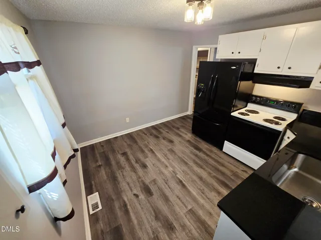 a view of workspace with wooden floor