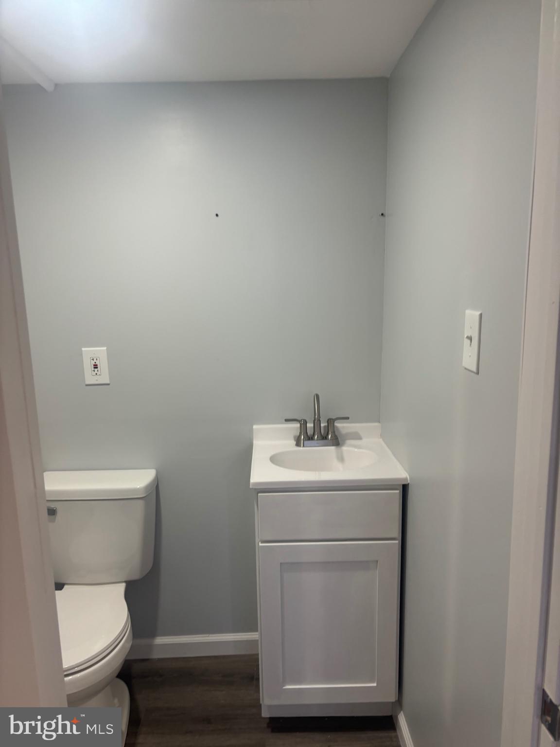 1870 Pratt Street Philadelphia, PA 19124 - Photo 16 of 23 a bathroom with a toilet a sink and mirror