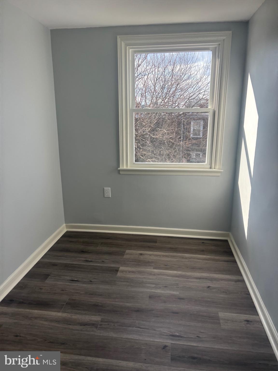 1870 Pratt Street Philadelphia, PA 19124 - Photo 5 of 23 a view of an empty room with wooden floor and a window