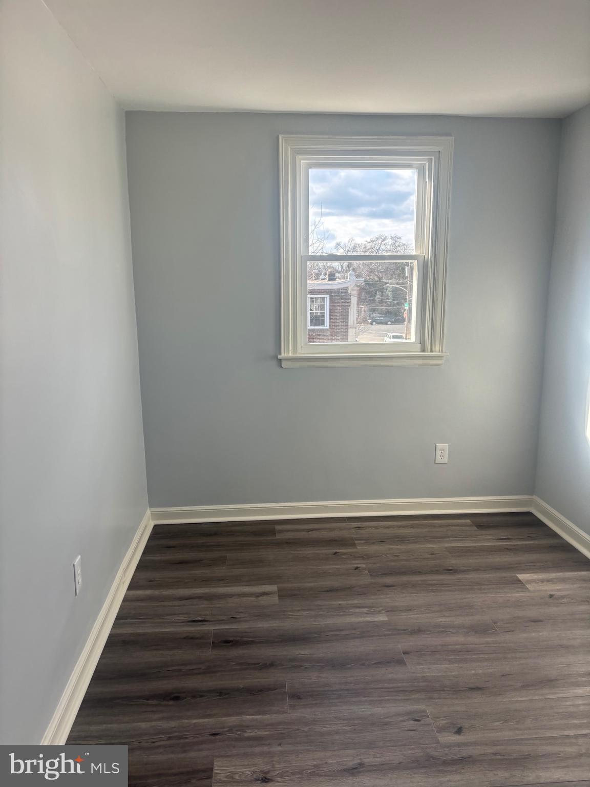 1870 Pratt Street Philadelphia, PA 19124 - Photo 7 of 23 a view of an empty room with wooden floor and a window